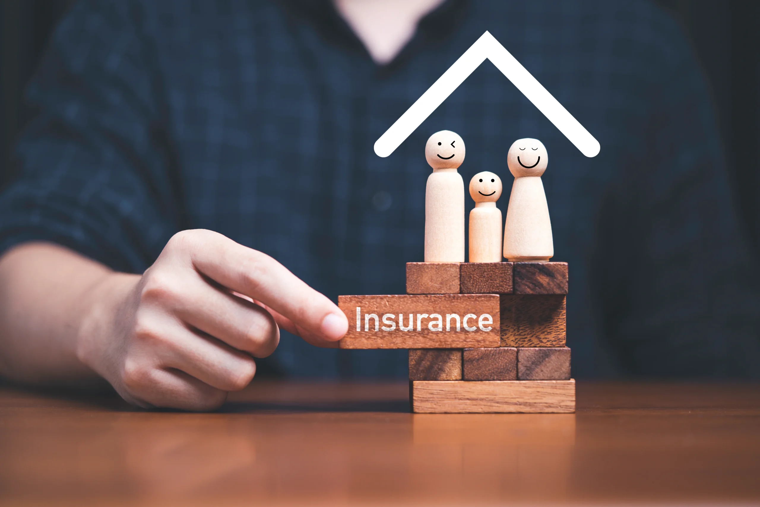 185048596_l Family standing on wooden block with hand pulling block which print screen insurance on it for assurance life and asset concept.